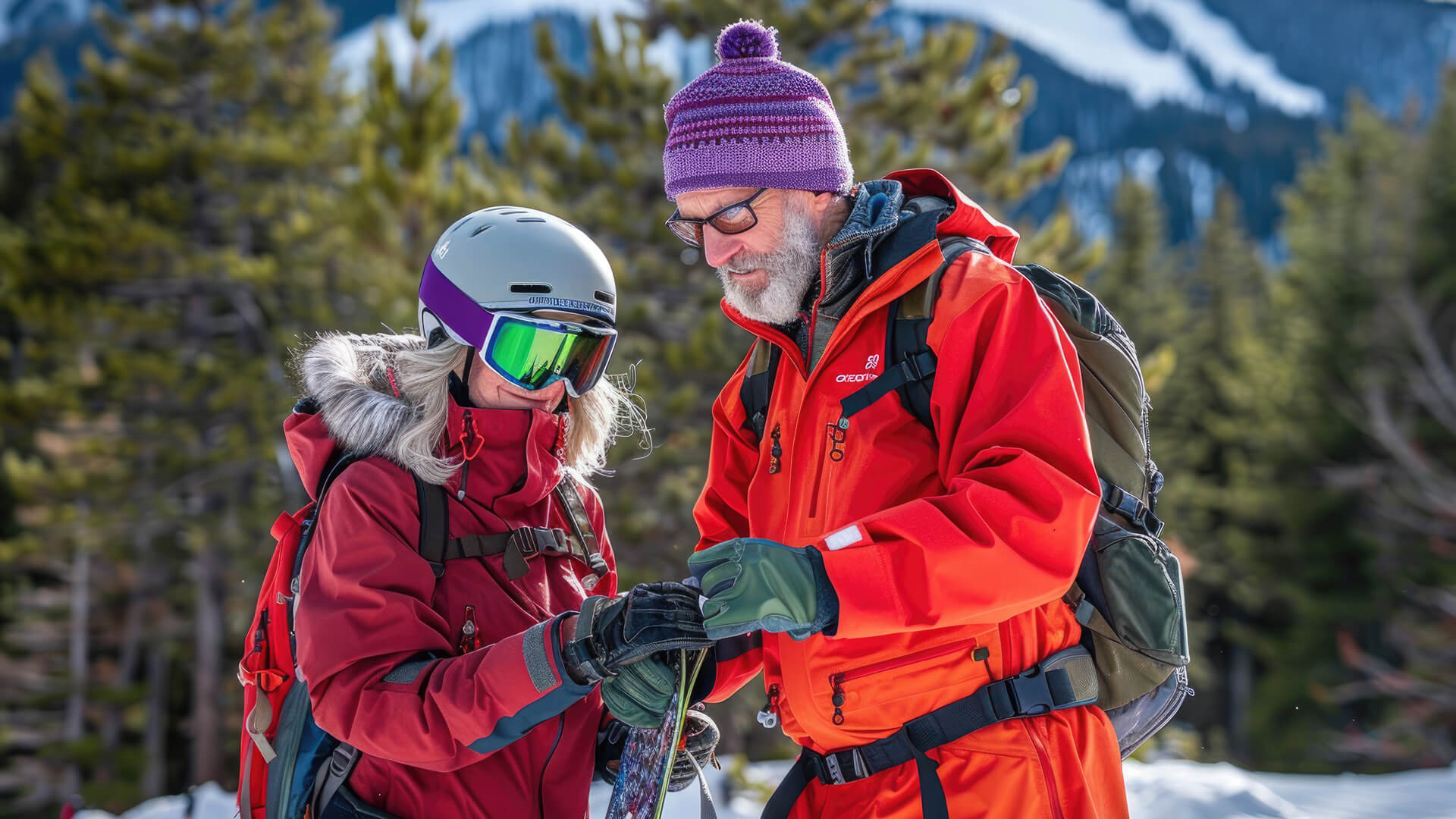 Two people in winter gear preparing for a ski activity in a snowy mountain setting.